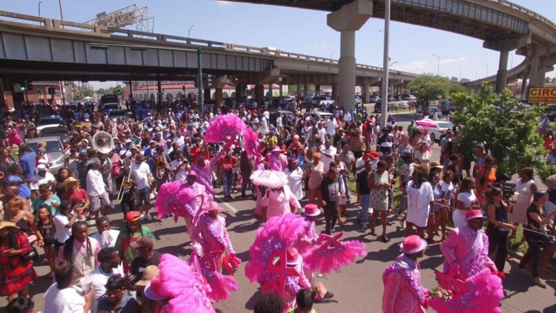 Members of the Original Big 7 social aid and pleasure club second-line in a scene from director Jason Berry's 2021 jazz funeral documentary 