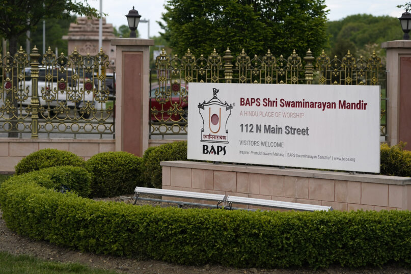 FILE - The entrance to the BAPS Shri Swaminarayan Mandir is seen in Robbinsville Township, N.J., Tuesday, May 11, 2021. A lawsuit in which workers accuse a Hindu organization of human trafficking by luring them from India to build the temple in New Jersey for as little as $1.20 a day has widened to four other states. In the initial lawsuit filed in May, workers at the Hindu temple in Robbinsville, claimed leaders of the Hindu organization known as Bochasanwasi Akshar Purushottam Swaminarayan Sanstha, or BAPS, coerced them into signing employment agreements and forced them to work more than 12 hours per day with few days off, under the watch of security guards.  (AP Photo/Seth Wenig, File)