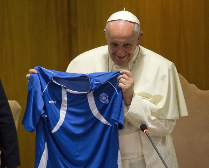 FILE - Pope Francis is presented with a jersey of the Salvador national soccer team during a meeting with participants in the 