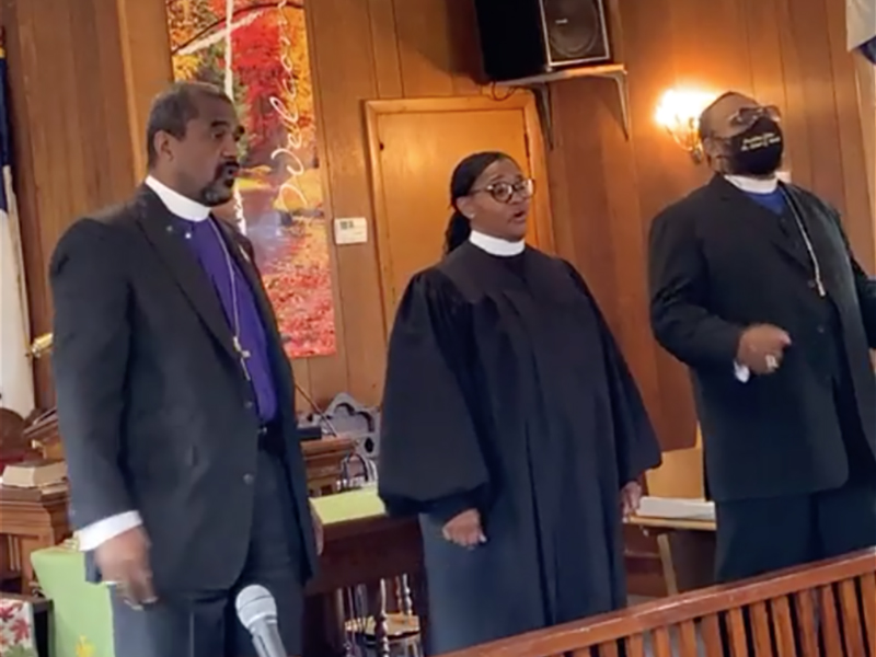 The Rev. Ratona Stokes-Robinson, center, during her first service inside St. James African Methodist Episcopal Church in Thorofare, New Jersey. Video screengrab