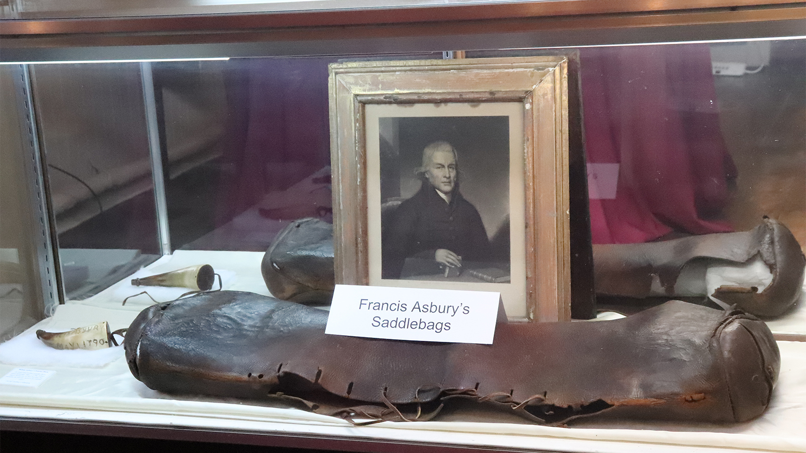 Francis Asbury’s powder horn, left, and saddlebags on display at Historic St. George’s United Methodist Church, Saturday, Oct. 30, 2021, in Philadelphia. RNS photo by Adelle M. Banks