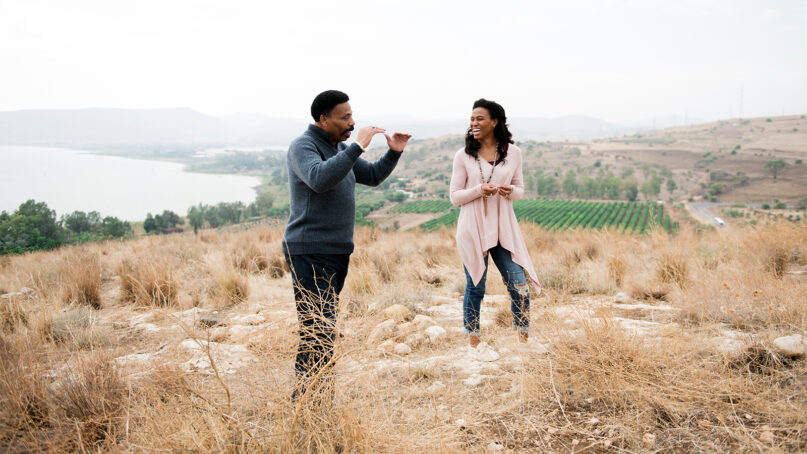 Pastor Tony Evans, left, and his daughter, Priscilla Shirer, talk upon a hill overlooking the Sea of Galilee in northern Israel, during a 2018 trip to the Holy Land. Photo courtesy of Journey with Jesus