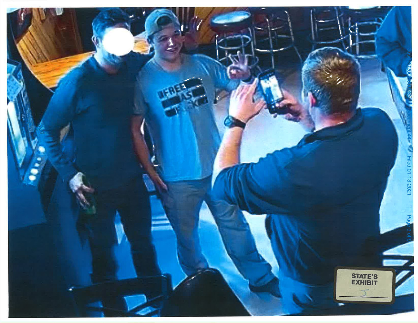 Kyle Rittenhouse was photographed drinking underage, wearing a "Free As F--k" shirt, and meeting members of the Proud Boys group at a bar in Jan. 2021, shortly after pleading not guilty to all charges. Photo via the Kenosha County District Attorney