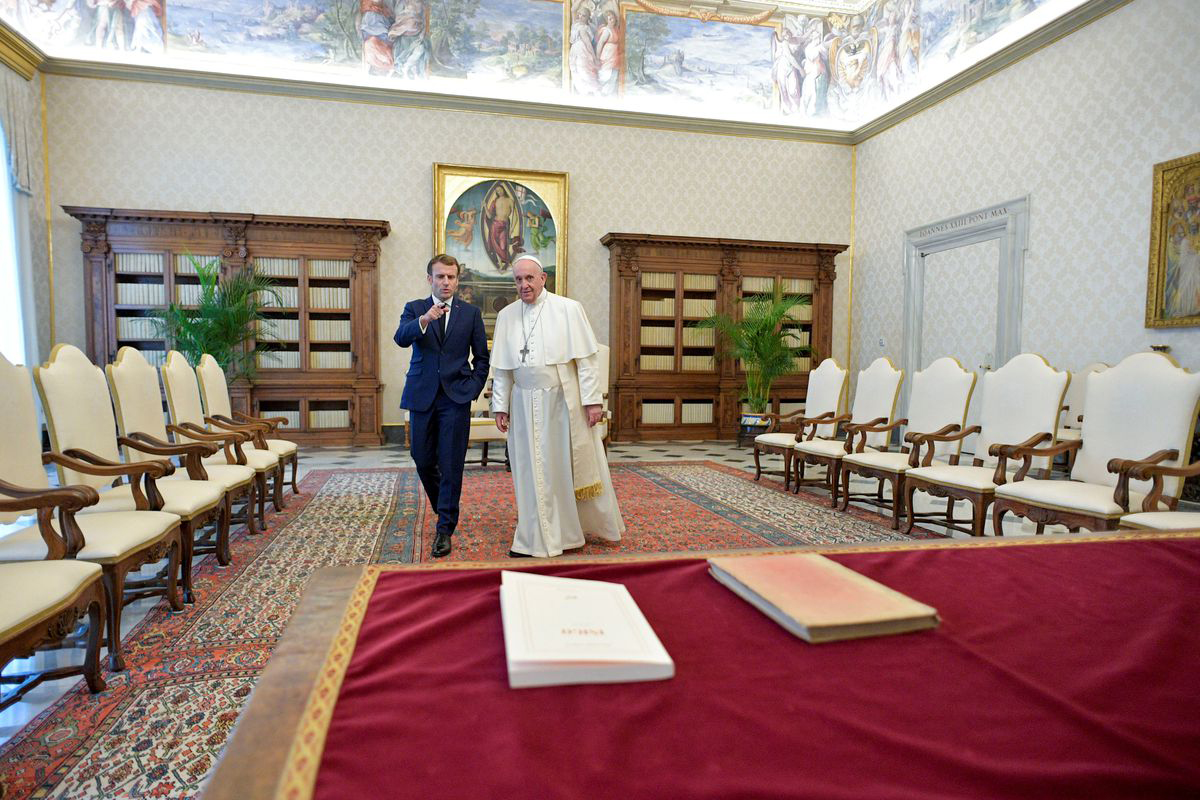 Pope Francis walks with French President Emmanuel Macron during a meeting at the Vatican, November 26, 2021. Photo by Vatican Media