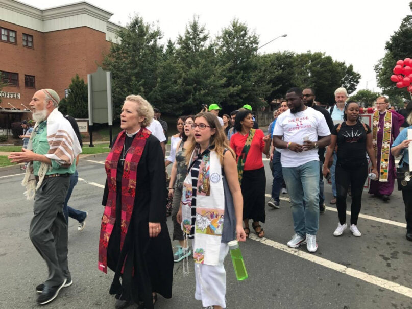 Rabbi Rachel Schmelkin, 28, right, of Congregation Beth Israel marches with other clergy the day of the Unite the Right rally in Charlottesville, Virginia, on Aug. 12, 2017. Photo by Hannah Pearce