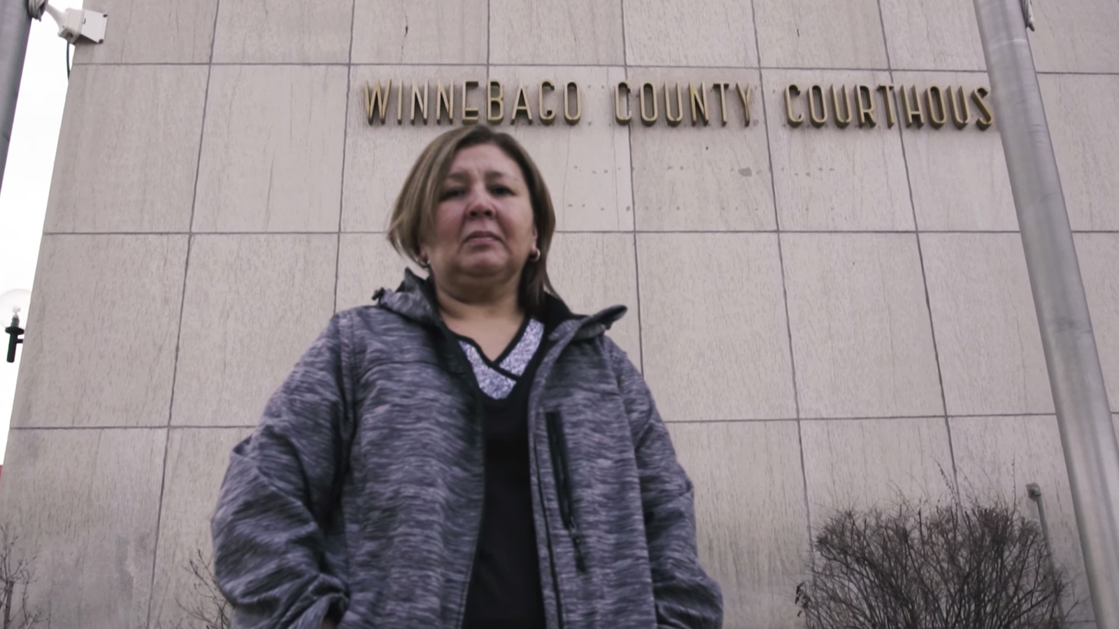 Nurse Sandra Rojas poses in front of the Winnebago County Courthouse in a video by Alliance Defending Freedom. Video screengrab
