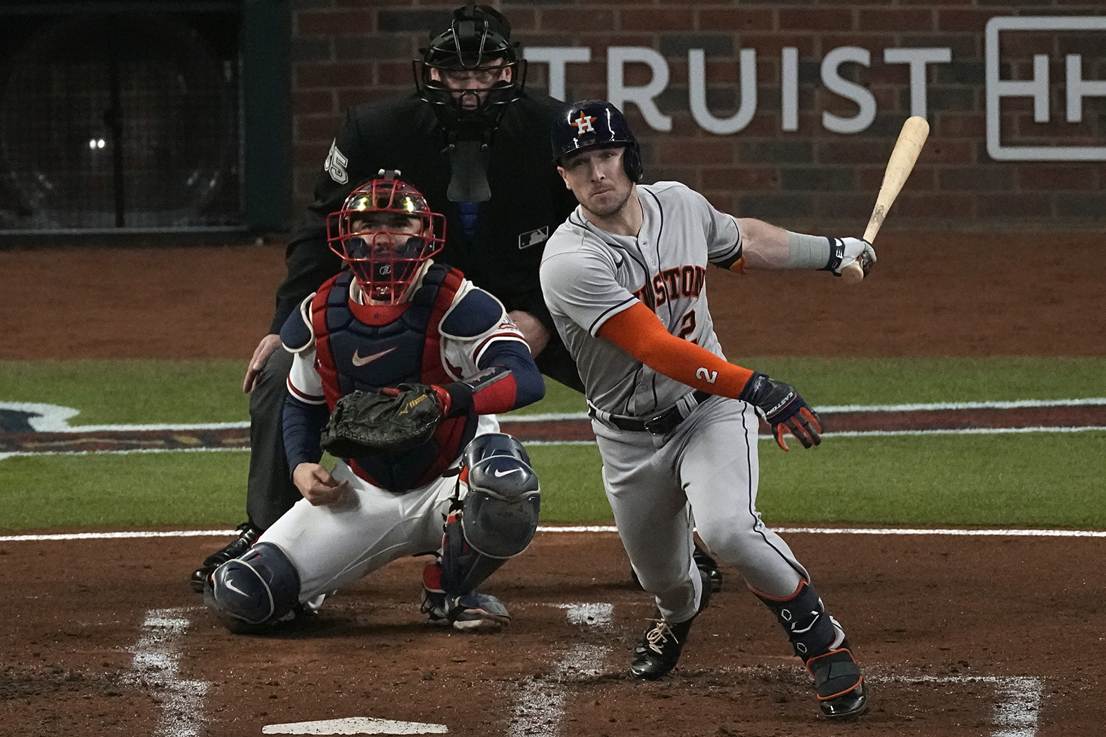 Houston Astros' Alex Bregman watches his RBI-double during the second inning in Game 5 of baseball's World Series between the Houston Astros and the Atlanta Braves Sunday, Oct. 31, 2021, in Atlanta. (AP Photo/John Bazemore)