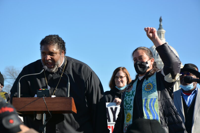 The Rev. William Barber and the Rev. Liz Theoharis, co-chairs of the Poor People's Campaign, lead a demonstration outside the U.S. Capitol on December 13, 2021. RNS photo by Jack Jenkins