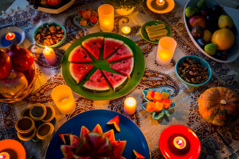 A table set for the celebration of the Persian festival of Yalda. ( Jasmin Merdan/Moment via Getty images.)