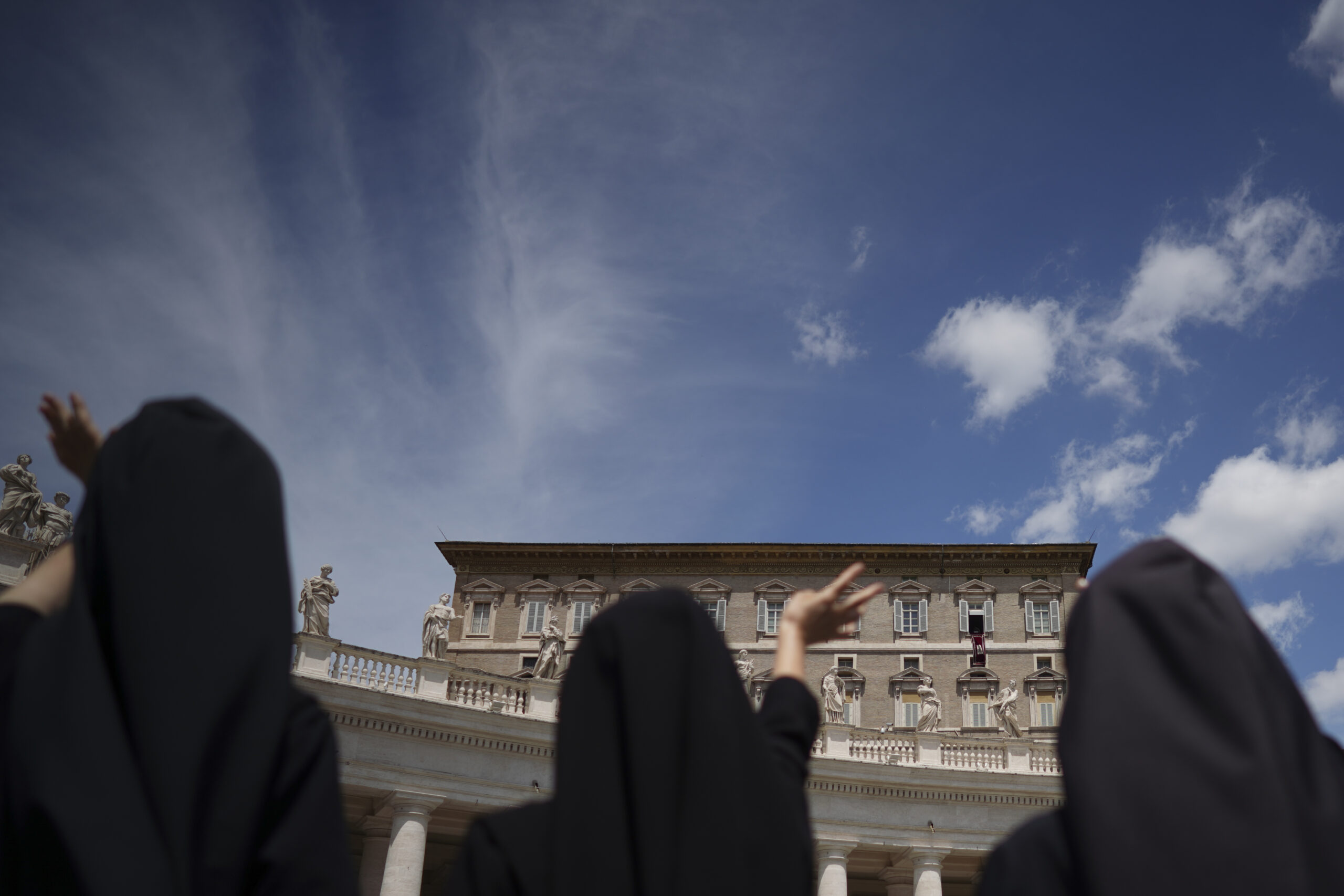 Nuns wave as Pope Francis delivers his blessing from his studio window overlooking St. Peter's Square, at the Vatican, June 7, 2020. On Saturday, Dec. 11, 2021, Pope Francis called attention to an issue taboo that the Vatican has long ignored or downplayed: the abuse of power by mother superiors against nuns who, because of their vows of obedience, have no recourse but to obey.  (AP Photo/Andrew Medichini)