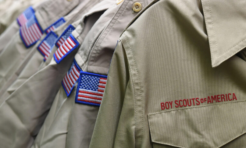 FILE - In this Feb. 18, 2020, file photo, Boy Scouts of America uniforms are displayed in a retail store at the headquarters for the French Creek Council of the Boy Scouts of America in Summit Township, Pa. In an agreement announced Monday, Dec. 13, 2021, attorneys in the Boy Scouts of America bankruptcy have reached a tentative settlement under which one of the organization's largest insurers would contribute $800 million into a fund for victims of child sexual abuse. (Christopher Millette/Erie Times-News via AP, File)