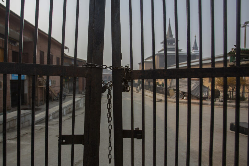 Kashmir's Jamia Masjid, or the grand mosque is seen through its gate that remains locked on Fridays in Srinagar, Indian controlled Kashmir, Nov. 26, 2021. Authorities allow the mosque to remain open the other six days, but only a few hundred worshippers assemble there on those occasions. Indian authorities see it as a trouble spot, a nerve center for anti-India protests and clashes that challenge New Delhi’s sovereignty over disputed Kashmir. For Kashmiri Muslims it is a symbol of faith, a sacred place where they offer not just mandatory Friday prayers but also raise their voice for political rights. (AP Photo/Mukhtar Khan)