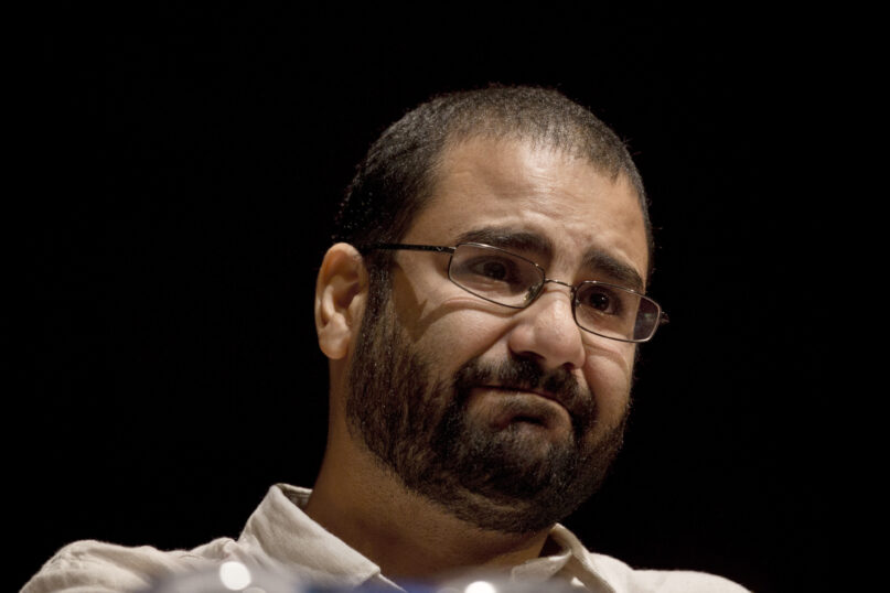 FILE - In this Sept. 22, 2014, file photo, Egypt's leading pro-democracy activist Alaa Abdel-Fattah speaks during a conference held at the American University in Cairo, Egypt. Egypt on Monday, Dec. 20, 2021 sentenced Alaa Abdel-Fattah to five years in prison on charges of spreading false news, a defense lawyer said. The activists former attorney and another activists were sentenced in the same case, to four years each. (AP Photo/Nariman El-Mofty, File)