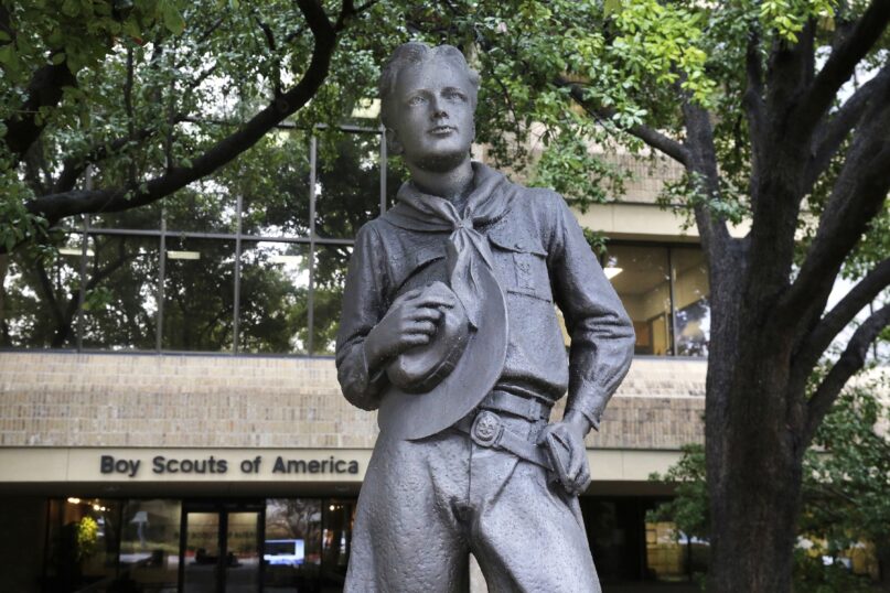 In this Feb. 12, 2020, file photo, a statue stands outside the Boy Scouts of America headquarters in Irving, Texas. Congregations affiliated with the United Methodist Church have agreed to contribute $30 million to a fund for victims who say they were molested as youngsters in the Boy Scouts of America, an attorney said Dec. 21, 2021. (AP Photo/LM Otero, File)