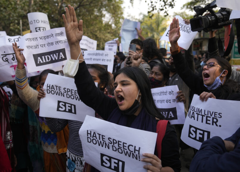 FILE- Activists of various left organizations shout slogans during a protest against hate speech in New Delhi, India, Dec.27, 2021. The protestors were reacting to a recent event at Haridwar in northern Uttarakhand state where some leaders made communally sensitive speeches at a religious gathering. Indian police on Thursday arrested a Hindu religious leader for allegedly making a derogatory speech against India’s independence leader Mohandas Gandhi and praising his assassin. (AP Photo/Manish Swarup, File)