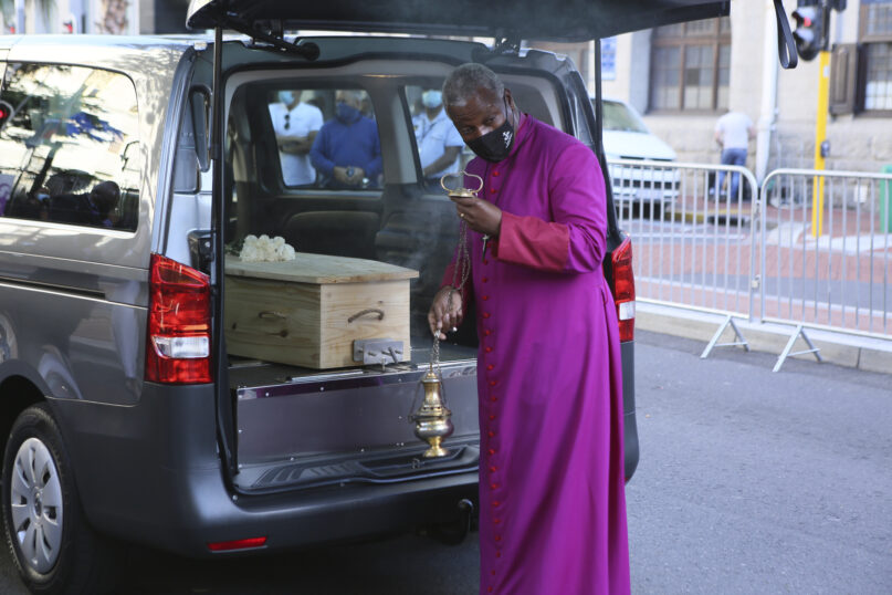 The coffin carrying the body of Anglican Archbishop Emeritus Desmond Tutu arrives at the St. George's Cathedral Friday, Dec. 31, 2021 where he will lie in state for a second day in Cape Town, South Africa. Tutu, the Nobel Peace Prize-winning activist for racial equality and LGBT rights died Sunday at the age of 90. (AP Photo/Tsvangirayi Mukwazhi)