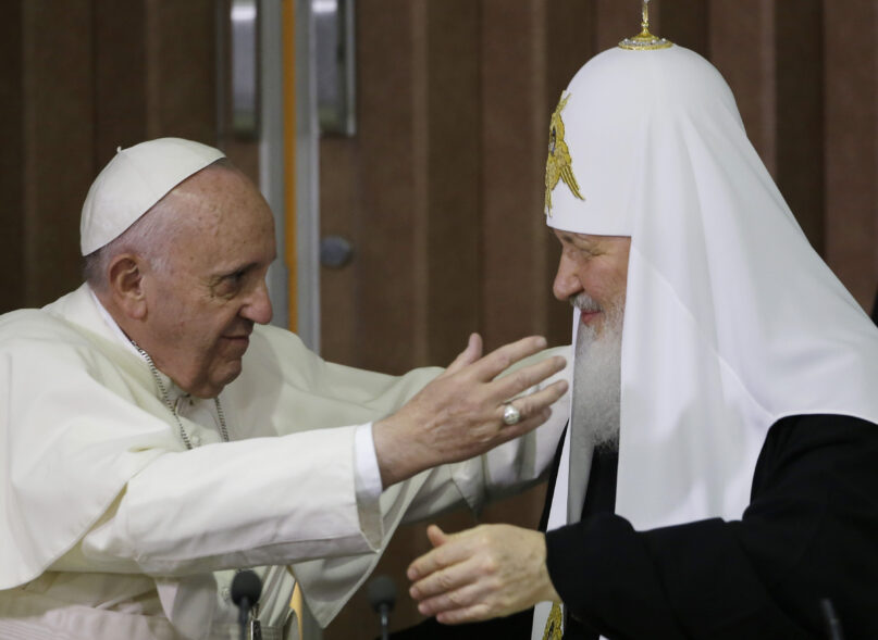 FILE - Pope Francis, left, reaches to embrace Russian Orthodox Patriarch Kirill after signing a joint declaration at the Jose Marti International airport in Havana, Cuba, Friday, Feb. 12, 2016. Plans are progressing for a meeting next year between Pope Francis and the leader of the Russian Orthodox Church following their historic encounter in Havana in 2016, a top Russian Orthodox official said Wednesday, Dec. 22, 2021.  (AP Photo/Gregorio Borgia, Pool, File)