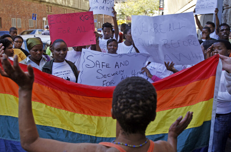 Women in Cape Town, South Africa, protest a sentence given to two men under Malawi’s anti-gay legislation on May 20, 2010. Desmond Tutu is being remembered for his passionate advocacy on behalf of LGBTQ people as well as his fight for racial justice. But the South African archbishop’s campaign against homophobia had limited impact in the rest of Africa. (AP Photo/Schalk van Zuydam, File)