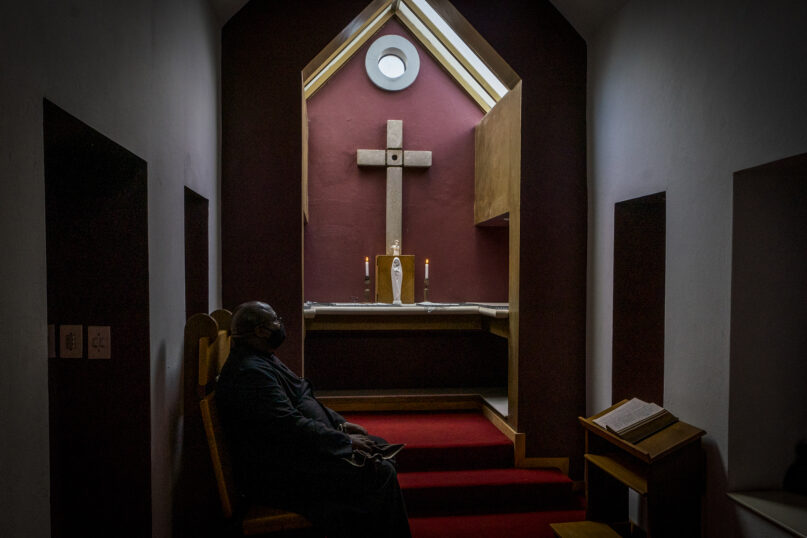 Archdeacon Sepadi Moruthane inside Anglican Archbishop Emeritus Desmond Tutu’s private chapel at the Soweto home Dec. 29, 2021. The Nobel Peace Prize-winning activist for racial equality and LGBT rights died Sunday at the age of 90. (AP Photo/Shiraaz Mohamed)