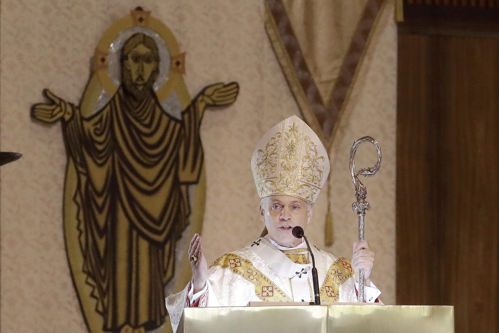 In this Sunday, April 12, 2020, file photo, San Francisco Archbishop Salvatore Cordileone celebrates Easter Mass, which was livestreamed, at St. Mary's Cathedral in San Francisco. (AP Photo/Jeff Chiu)