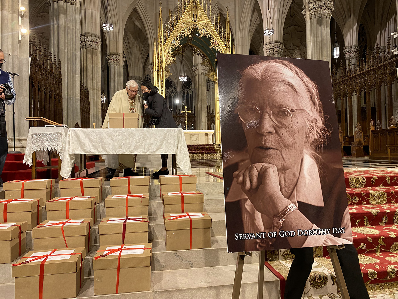 Cardboard boxes filled with evidence of Dorothy Day’s “reputation for holiness” sit after a Mass at St. Patrick's Cathedral in New York, Wednesday, Dec. 8, 2021. The boxes will be sent to the Congregation for the Causes of Saints in Rome. RNS photo by Renée Roden
