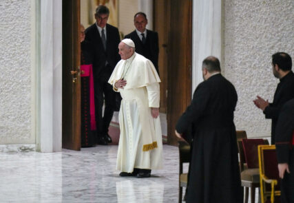 Pope Francis arrives to attend his weekly general audience in the Vatican's Paul VI Hall, Dec. 15, 2021. (AP Photo/Alessandra Tarantino)
