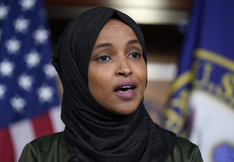 Rep. Ilhan Omar, D-Minn., speaks to reporters in the wake of anti-Islamic comments made last week by Rep. Lauren Boebert, R-Colo., who likened Omar to a bomb-carrying terrorist. Omar spoke during a news conference at the Capitol in Washington,  Nov. 30, 2021. (AP Photo/J. Scott Applewhite)