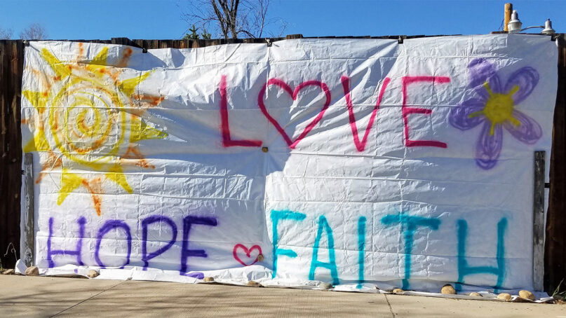 A sign expressing Love, Hope and Faith is displayed during the pandemic in May 2020. Photo by Xnatedawgx/Wikipedia/Creative Commons