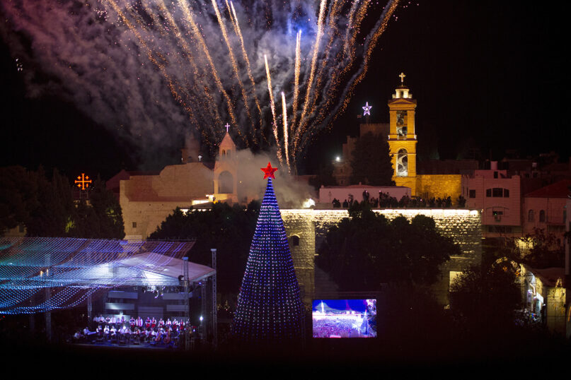 Fireworks burst over the Church of the Nativity in Manger Square in the West Bank town of Bethlehem during the lighting of the Christmas tree, Dec. 4, 2021. (AP Photo/Maya Alleruzzo)