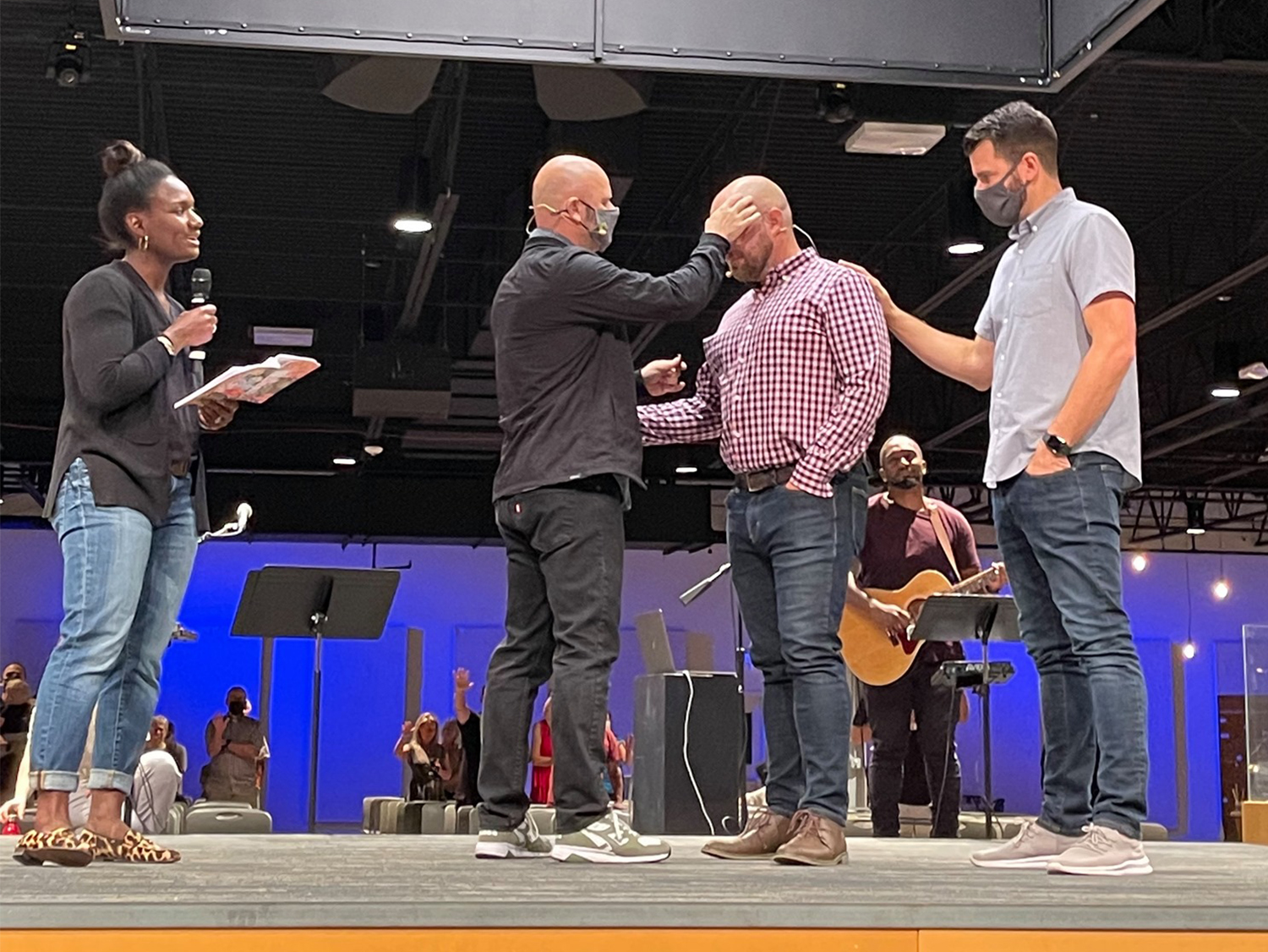 Co-pastors Ashlee Eiland, from left, and Troy Hatfield lead a service at Mars Hill Bible Church in Grandville, Michigan, in Sept. 2021. Courtesy photo