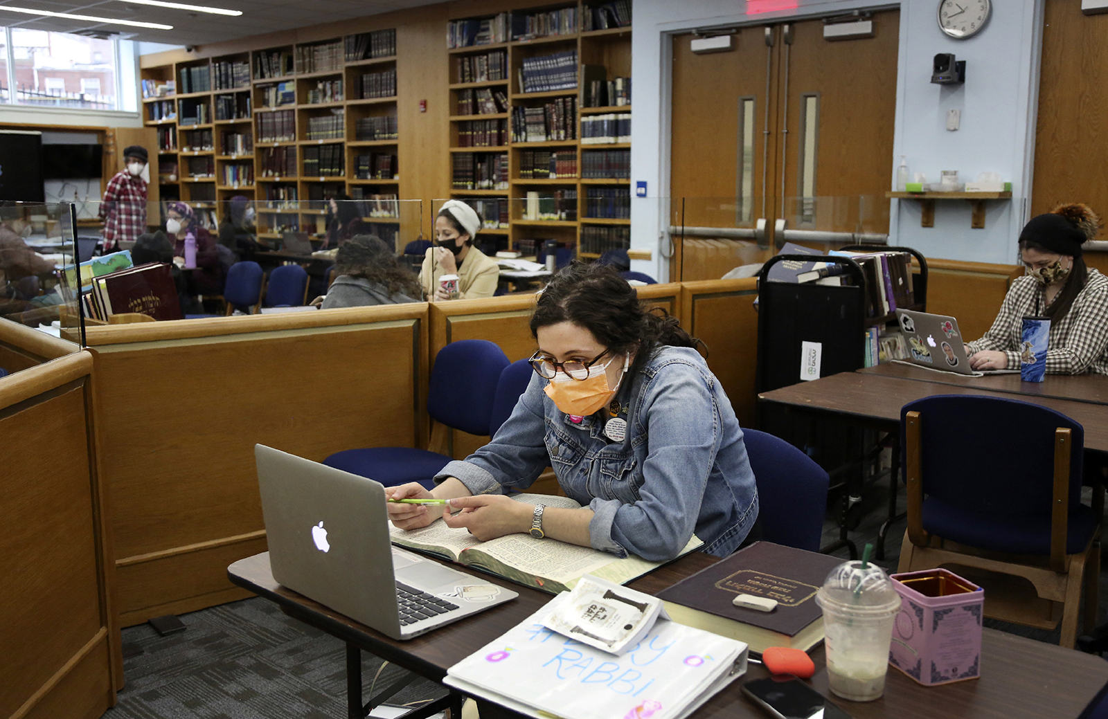 Naima Hirsch, an ordination program student, studies in the beit midrash, a space for learning, at Yeshivat Maharat in the Bronx borough of New York, on Wednesday, Dec. 8, 2021. Yeshivat Maharat is the only U.S. seminary that ordains Orthodox Jewish women. (AP Photo/Jessie Wardarski)
