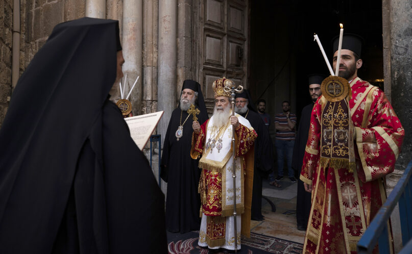 Greek Orthodox Patriarch of Jerusalem Theophilos III, center, walks in procession in the Old City of Jerusalem, April 29, 2021. (AP Photo/Maya Alleruzzo)