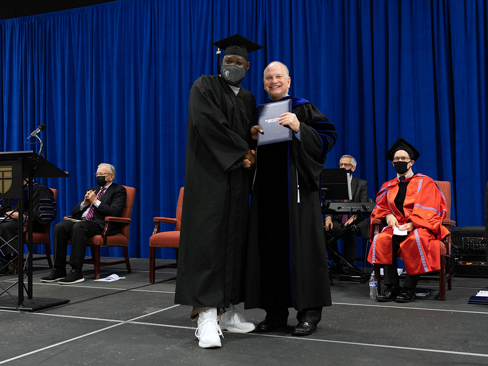 Danny Akin, right, poses with a graduate during the College at Southeastern graduation ceremony, Wednesday, Dec. 15, 2021, at Nash Correctional Institution in Nashville, North Carolina. Photo courtesy of Southeastern Baptist Theological Seminary in Wake Forest, North Carolina
