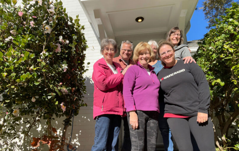 Members of Judea Reform Congregation are co-sponsoring a family evacuated from Afghanistan. They pose beside the rental home they secured for the family in Durham, North Carolina. Left to right: Janice Woychik, David Rousso, Lynda Carlson, Marian Abernathy, Carrie Norry, Laura Ades. Photo courtesy of Carrie Norry