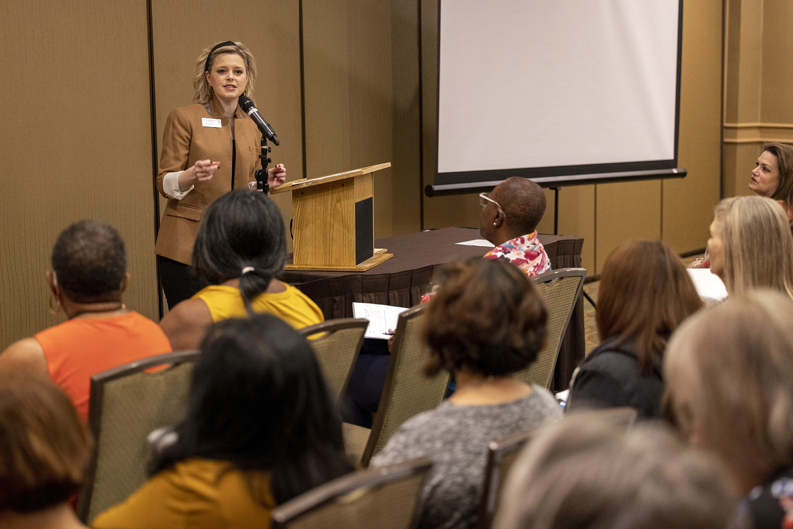 In this photo provided by Jerry Neil Williams of Texas Baptist, Katie McCoy lectures at the 2021 Texas Baptist Annual Meeting in Galveston, Texas, on Nov. 16, 2021. McCoy led a workshop titled, "Beyond the Mask: Ministry to Women in a Post-COVID World." (Texas Baptist via AP)