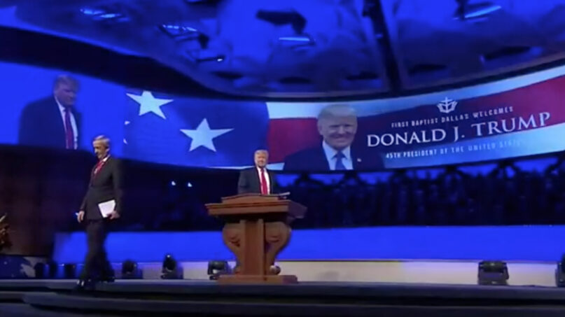 Robert Jeffress leaves the stage after introducing former President Donald Trump,  Dec. 19, 2021, at First Baptist Dallas. Video screen grab