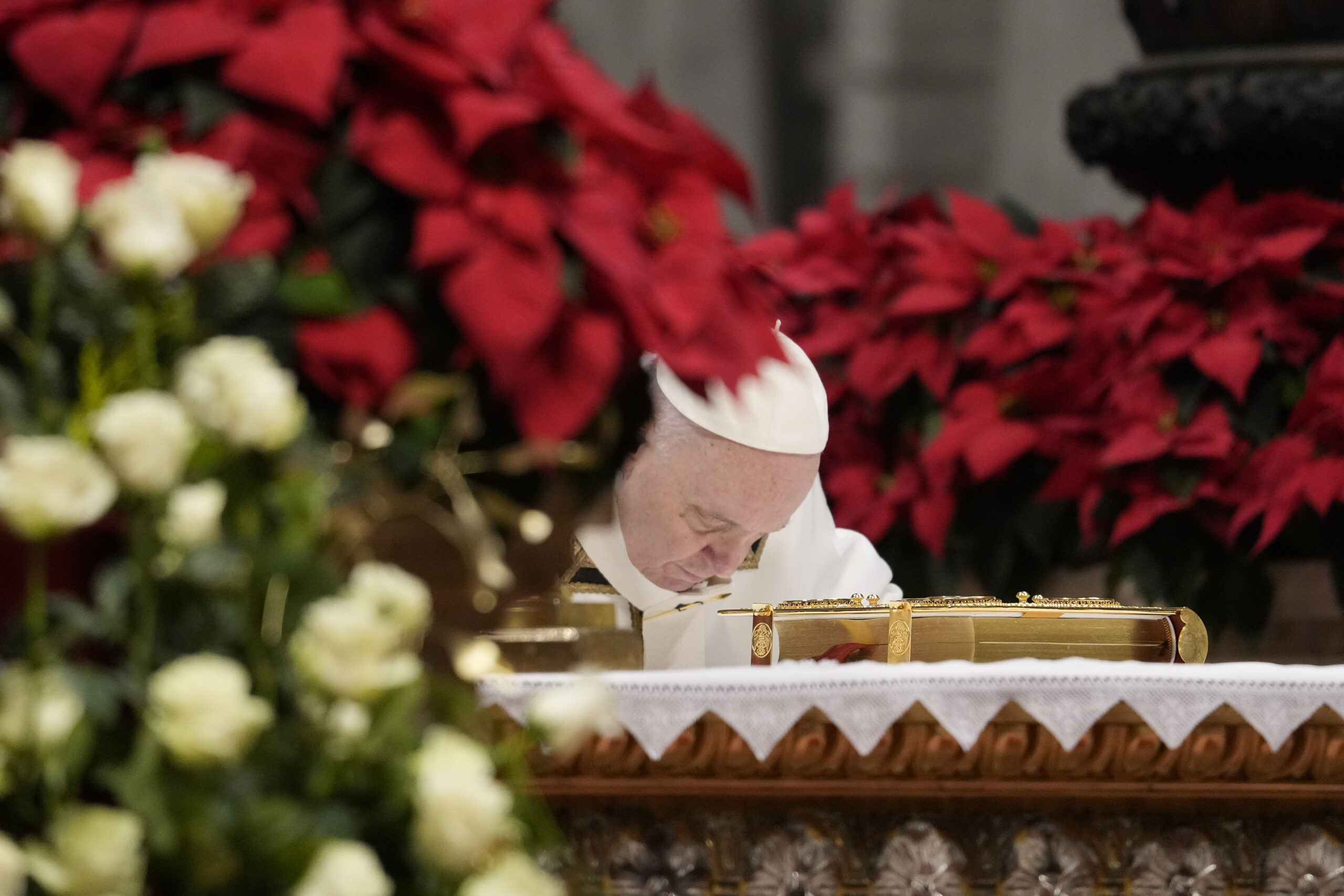Pope Francis bows on the altar as he celebrates an Epiphany mass in St. Peter's Basilica, at the Vatican, Thursday, Jan. 6, 2022. (AP Photo/Gregorio Borgia)