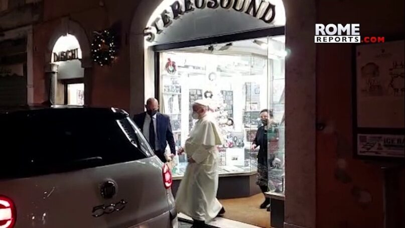 In this image from video made available by Javier Martinez Brocal of Rome Reports, Pope Francis leaves a record shop in Rome, Jan. 11, 2022. (Javier Martinez Brocal/Rome Reports via AP)