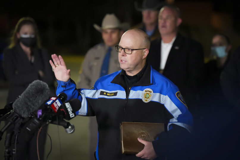 Colleyville Police Chief Michael Miller addresses reporters in a nearby parking lot after the conclusion of a SWAT operation at Congregation Beth Israel synagogue on Jan. 15, 2022, in Colleyville, Texas. All four people taken hostage inside the synagogue during a morning service were safe that night after an hourslong standoff, authorities said. (Smiley N. Pool/The Dallas Morning News via AP)