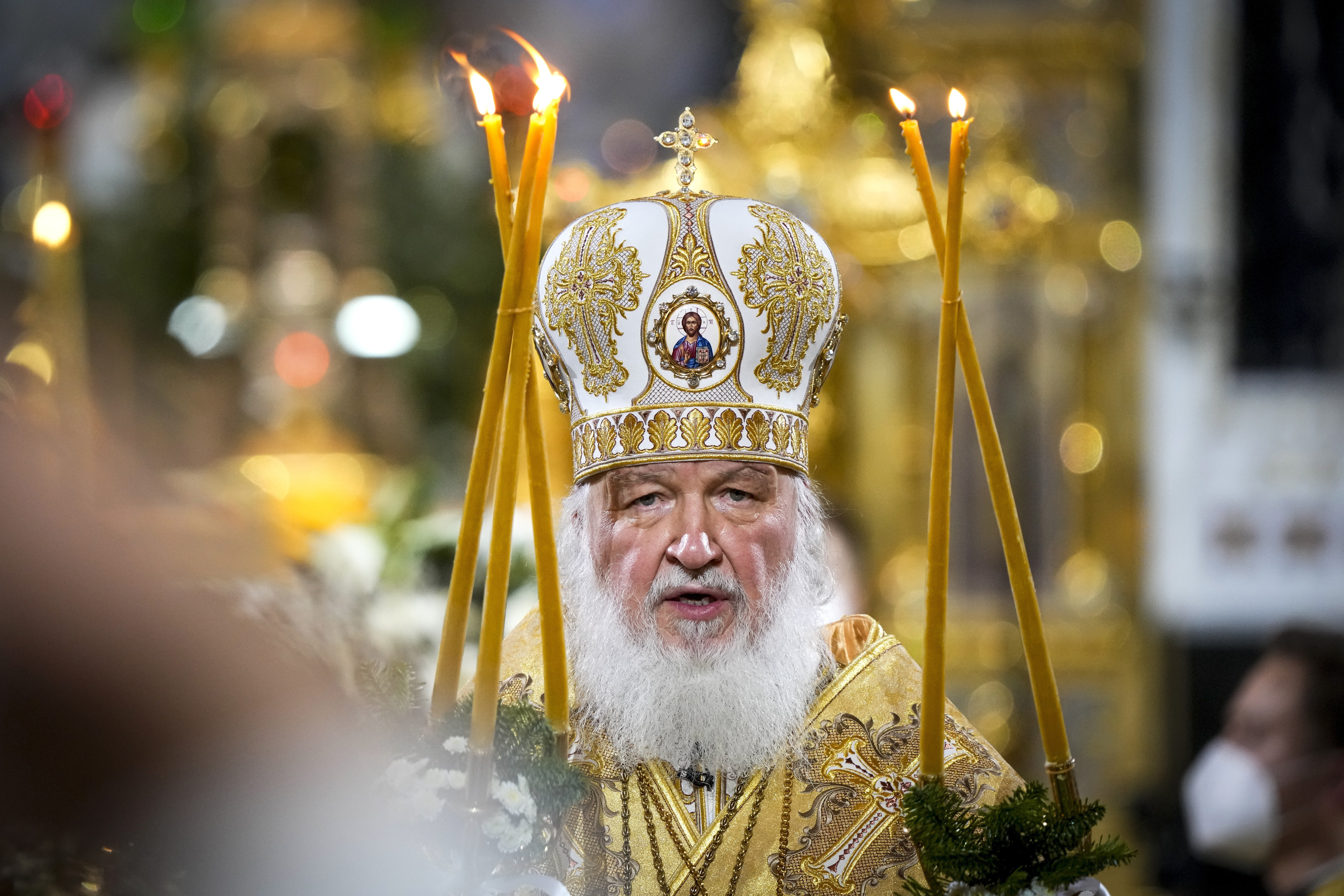 Russian Orthodox Patriarch Kirill delivers the Christmas Liturgy in the Christ the Saviour Cathedral in Moscow, Russia, Thursday, Jan. 6, 2022. Parishioners wearing face masks to protect against coronavirus, observed social distancing guidelines as they attended the liturgy Orthodox Christians celebrate Christmas on Jan. 7, in accordance with the Julian calendar. (AP Photo/Alexander Zemlianichenko)