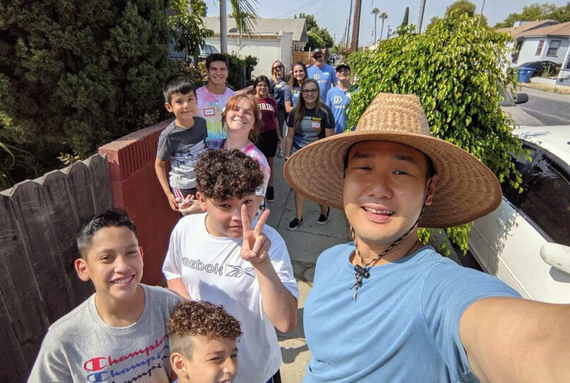 Pastor Min Lee, right, leads a young group of LA City Baptist Church congregants on a walk through the community to pray for church neighbors. Photo courtesy of LA City Baptist Church