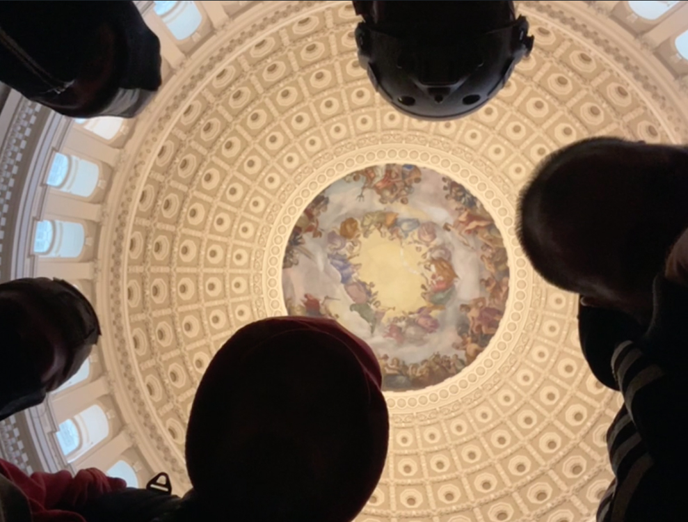 A group of insurrectioninsts pray together in the Capitol Rotunda during the breach on Jan. 6, 2021. Video screengrab
