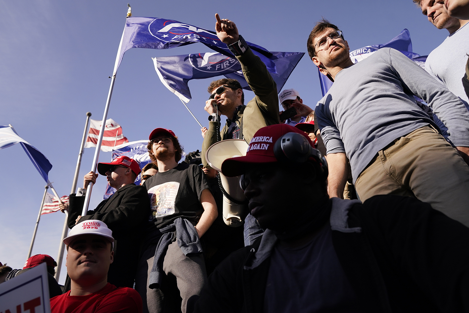 Nick Fuentes, center, speaks to supporters of President Donald Trump during a pro-Trump march Saturday, Nov. 14, 2020, in Washington. (AP Photo/Jacquelyn Martin)