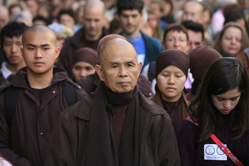 Thich Nhat Hanh leads a walking meditation in Paris. ()