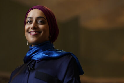 Madinah Javed smiles during an interview on her role in encouraging female reciters of the Quran, in a prayer room at the American Islamic College Thursday, Jan. 27, 2022, in Chicago. Javed, who grew up in Scotland and now lives in Chicago, has turned to social media to highlight existing #FemaleReciters like herself while inspiring more to share recitations. (AP Photo/Charles Rex Arbogast)