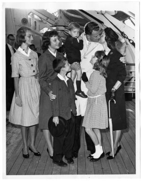 Evangelist Billy Graham greets his wife and family in New York upon their arrival on the Queen Elizabeth ship in 1960. Ruth Graham and the children spent the summer in Switzerland. Billy Graham holds his son, Ned, 2. The other children are, from left, Anne, 12, Gigi, 15, Franklin, 8, and Bunny, 9. RNS archive photo. Photo courtesy of the Presbyterian Historical Society.