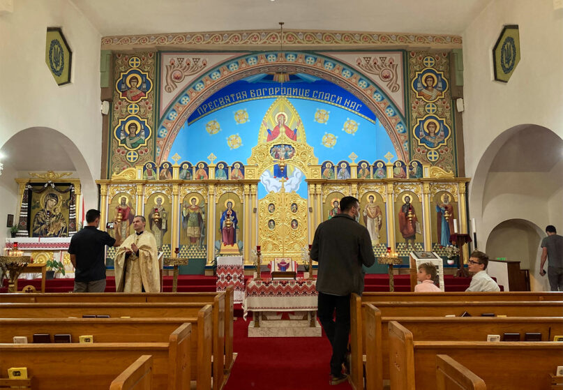 People attend a prayer vigil at Nativity of the Blessed Virgin Mary, a Ukrainian Catholic Church, Thursday, Feb. 24, 2022, in Los Angeles. RNS photo by Alejandra Molina