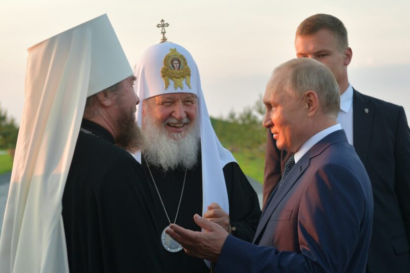 Vladimir Putin speaks to Russian Orthodox Church Patriarch Kirill (center) in Samolva, Russia, on Sept. 11, 2021.  (Alexei Druzhinin/Pool Photo via AP)