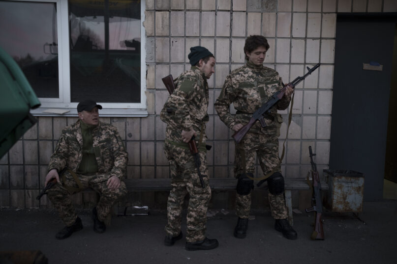 Civilian volunteers attend a training camp of the Ukrainian Territorial Defense Forces in Brovary, northeast of Kyiv, Ukraine, March 21, 2022. (AP Photo/Felipe Dana)