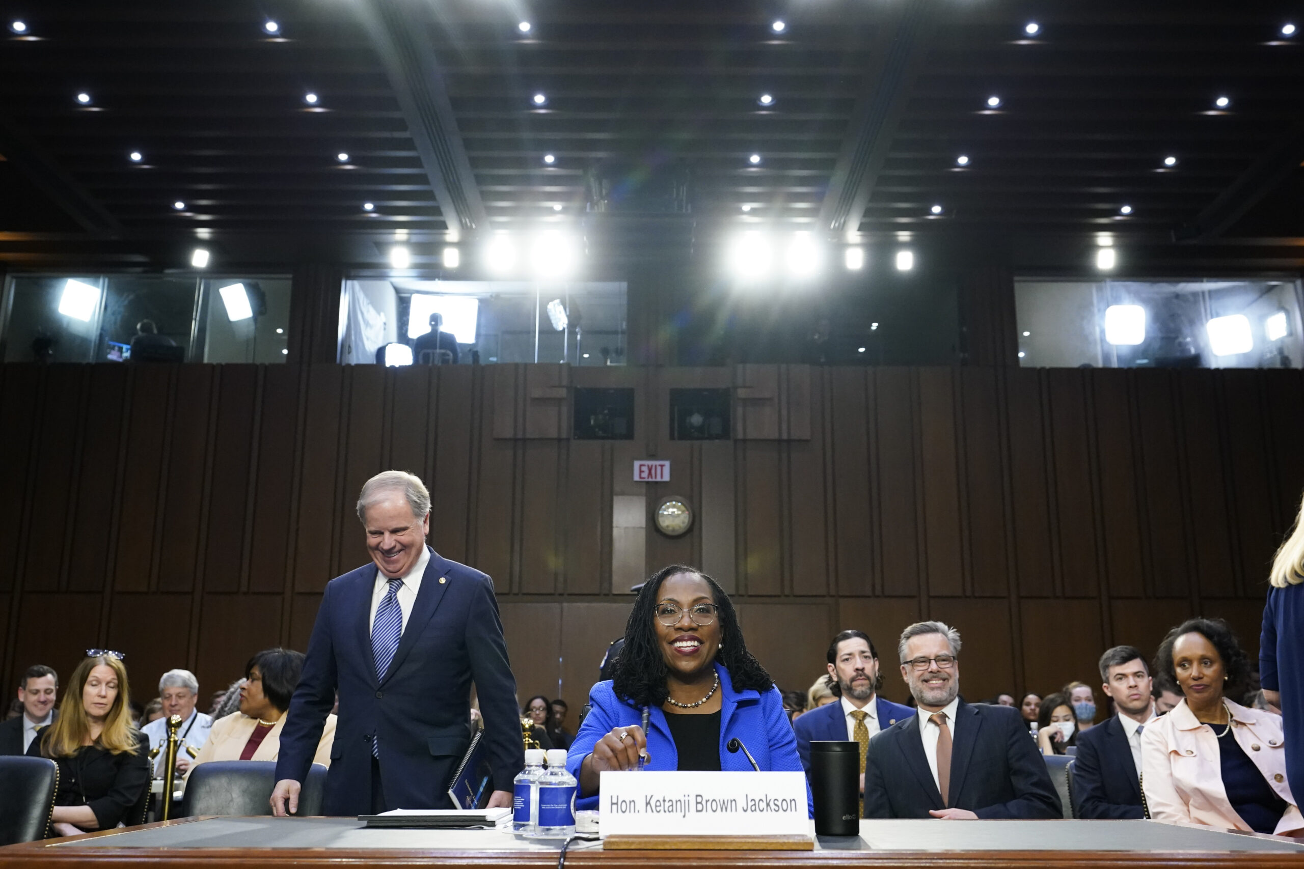 Supreme Court nominee Ketanji Brown Jackson returns from a break in her Senate Judiciary Committee confirmation hearing on Capitol Hill in Washington, Wednesday, March 23, 2022. Former Sen. Doug Jones, D-Ala., is at center left. (AP Photo/Alex Brandon)